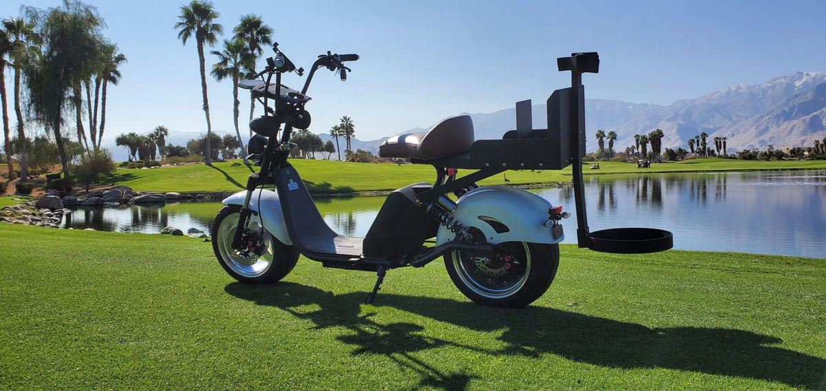 Dual hydraulic suspension on Harley-style golf scooter for smooth rides over rough terrain