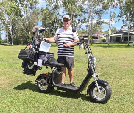Electric golf scooter with steel frame and golf bag stand for secure club storage during rides