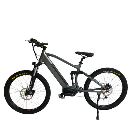 Shimano 9-speed electric bike with DNM rear shock absorber for rugged mountain terrain and puncture resistant tires