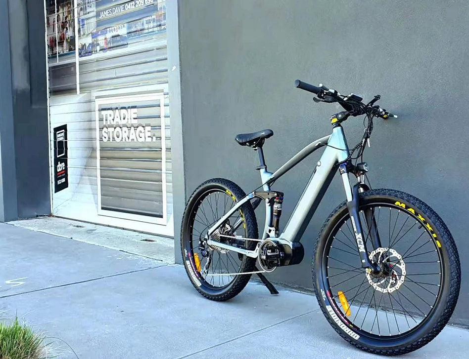 High-torque electric mountain bike with RST suspension fork and Tektro disc brakes for off-road trails